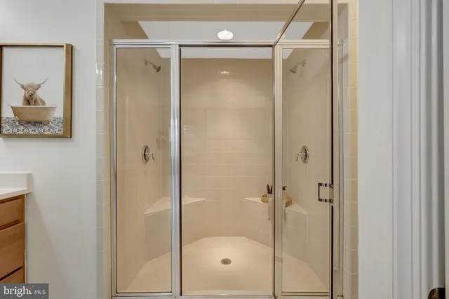 a bathroom with a glass shower door