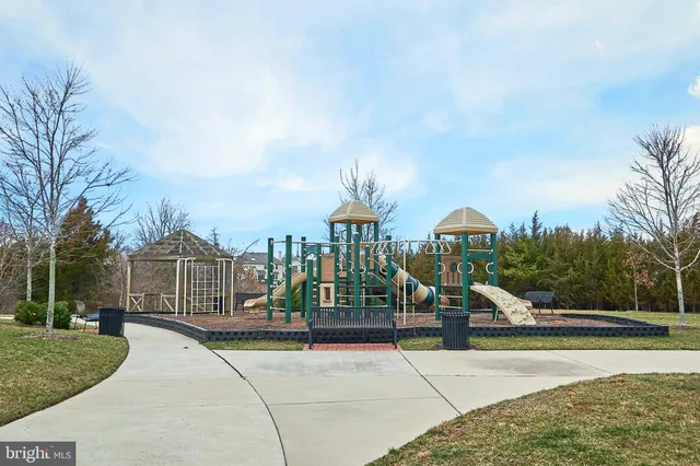a view of a park with iron fence