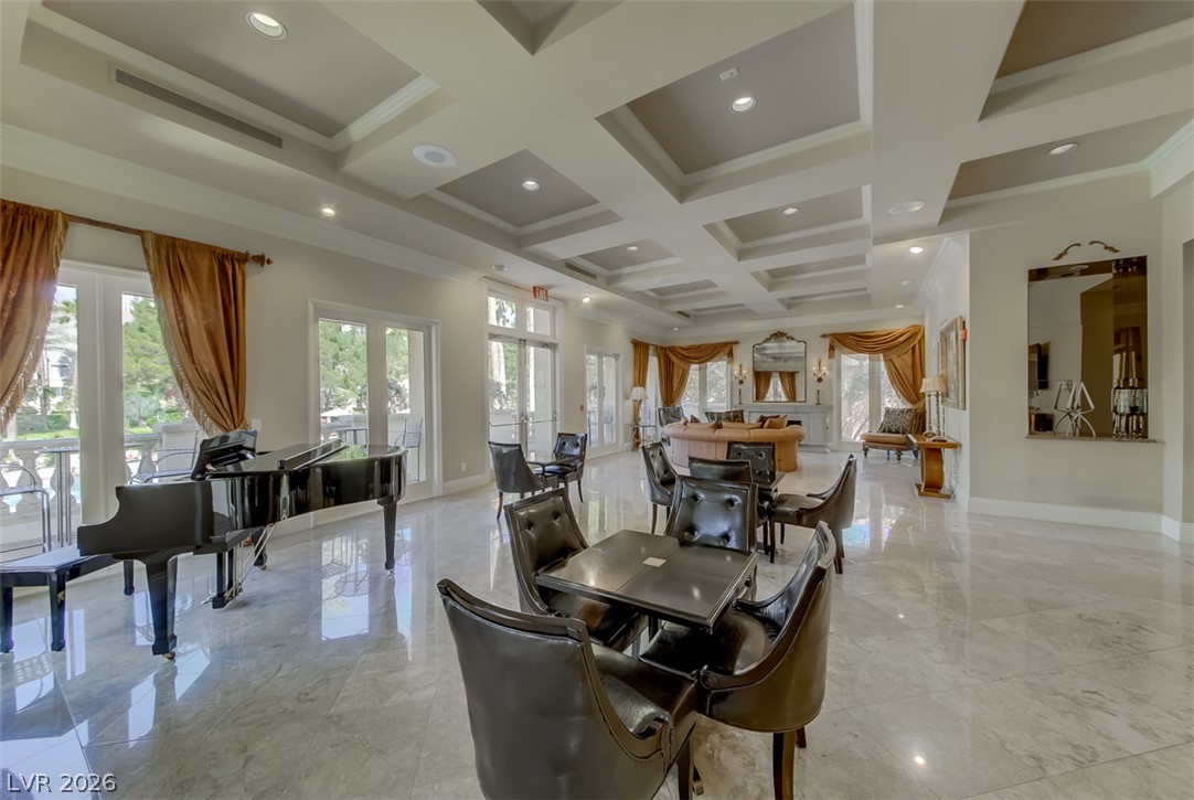 230 East Flamingo Road, Unit 334 Las Vegas, NV 89169 - Photo 23 of 37 Gleaming polished tile floors reflect light beneath a magnificent coffered ceiling in this grand space.