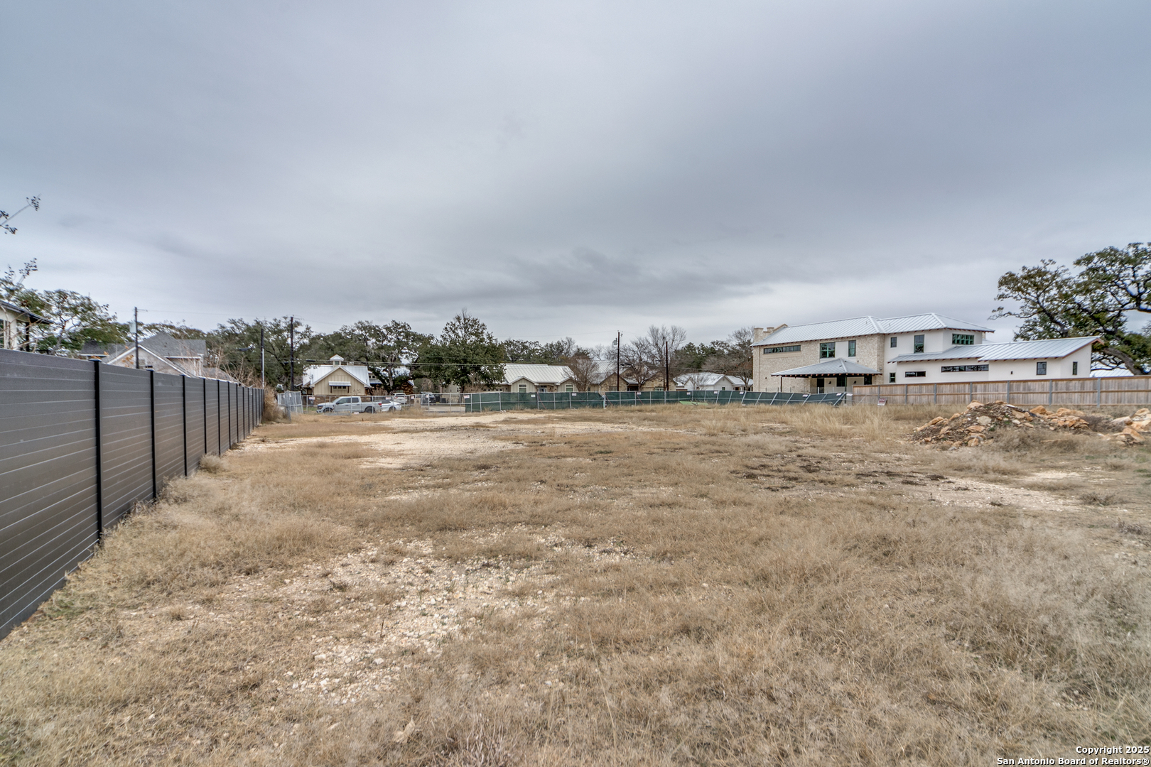 110 2nd Street Boerne, TX 78006 - Photo 3 of 6 a view of a yard with wooden fence