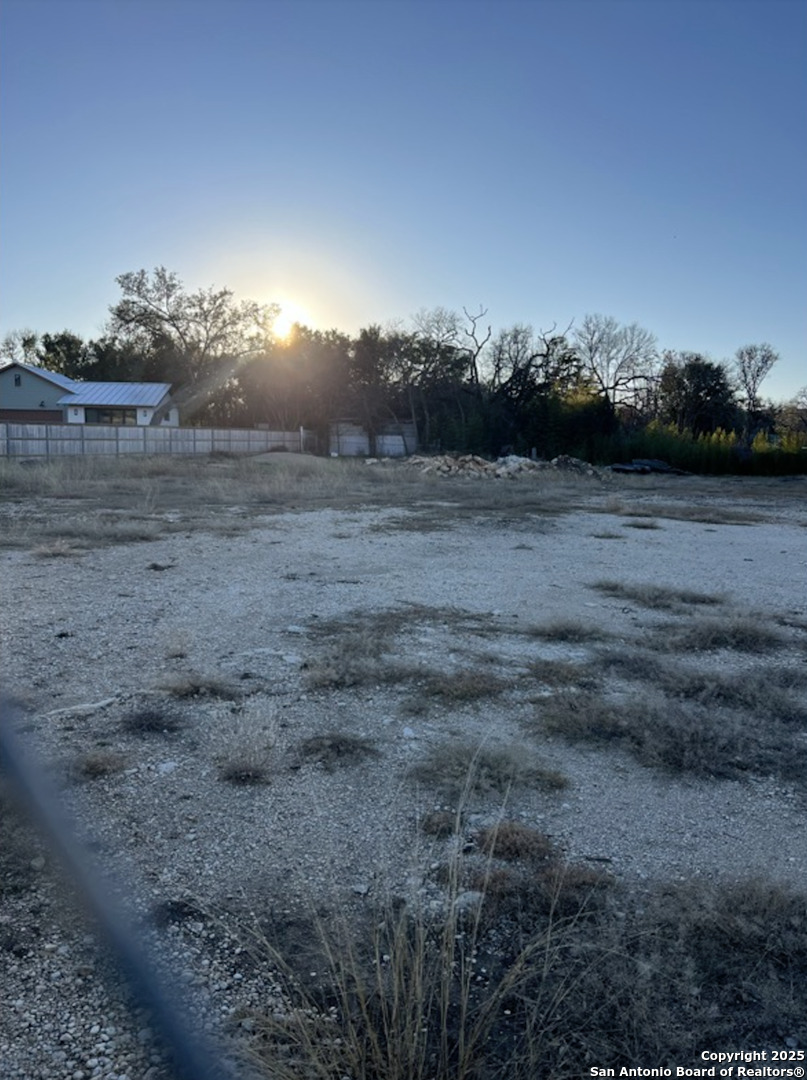 110 2nd Street Boerne, TX 78006 - Photo 5 of 6 a view of a dry yard with wooden fence
