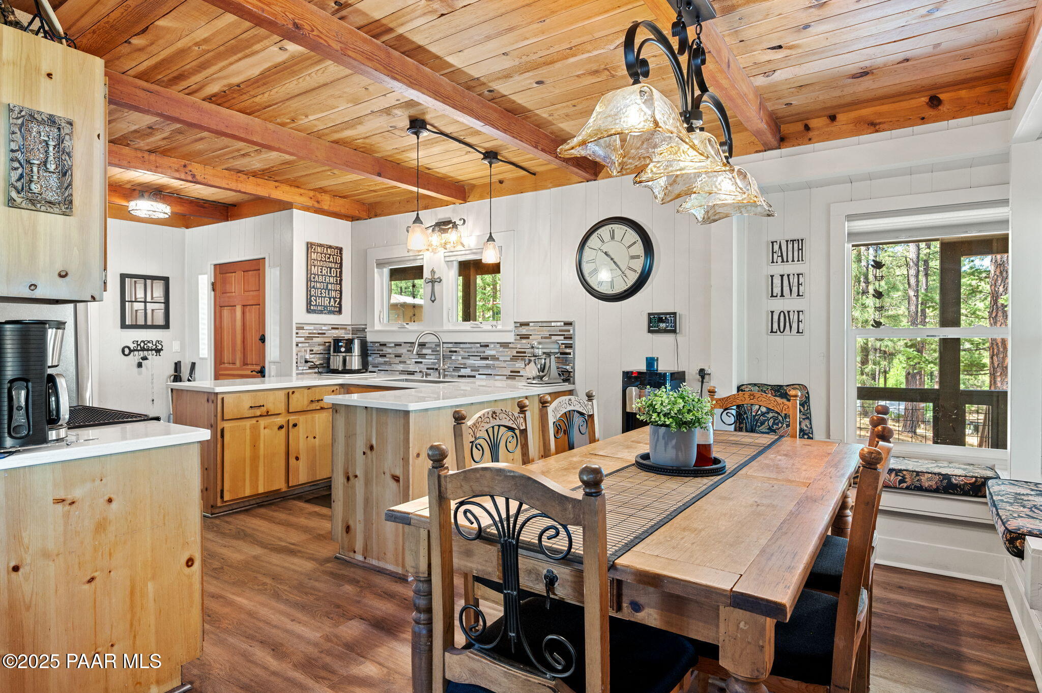 6231 South Champion Way Road Prescott, AZ 86303 - Photo 12 of 43 a view of a dining room with furniture window and wooden floor