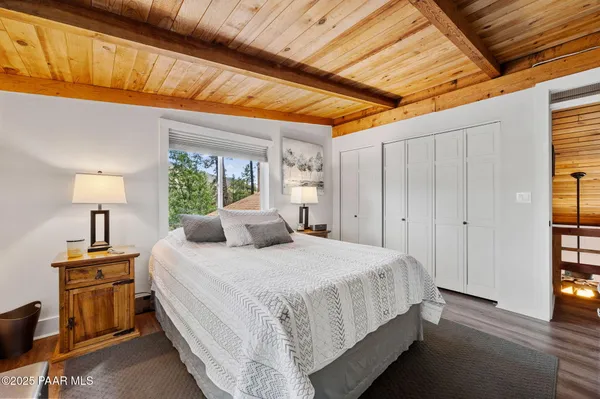 a bedroom with a bed and a lamp