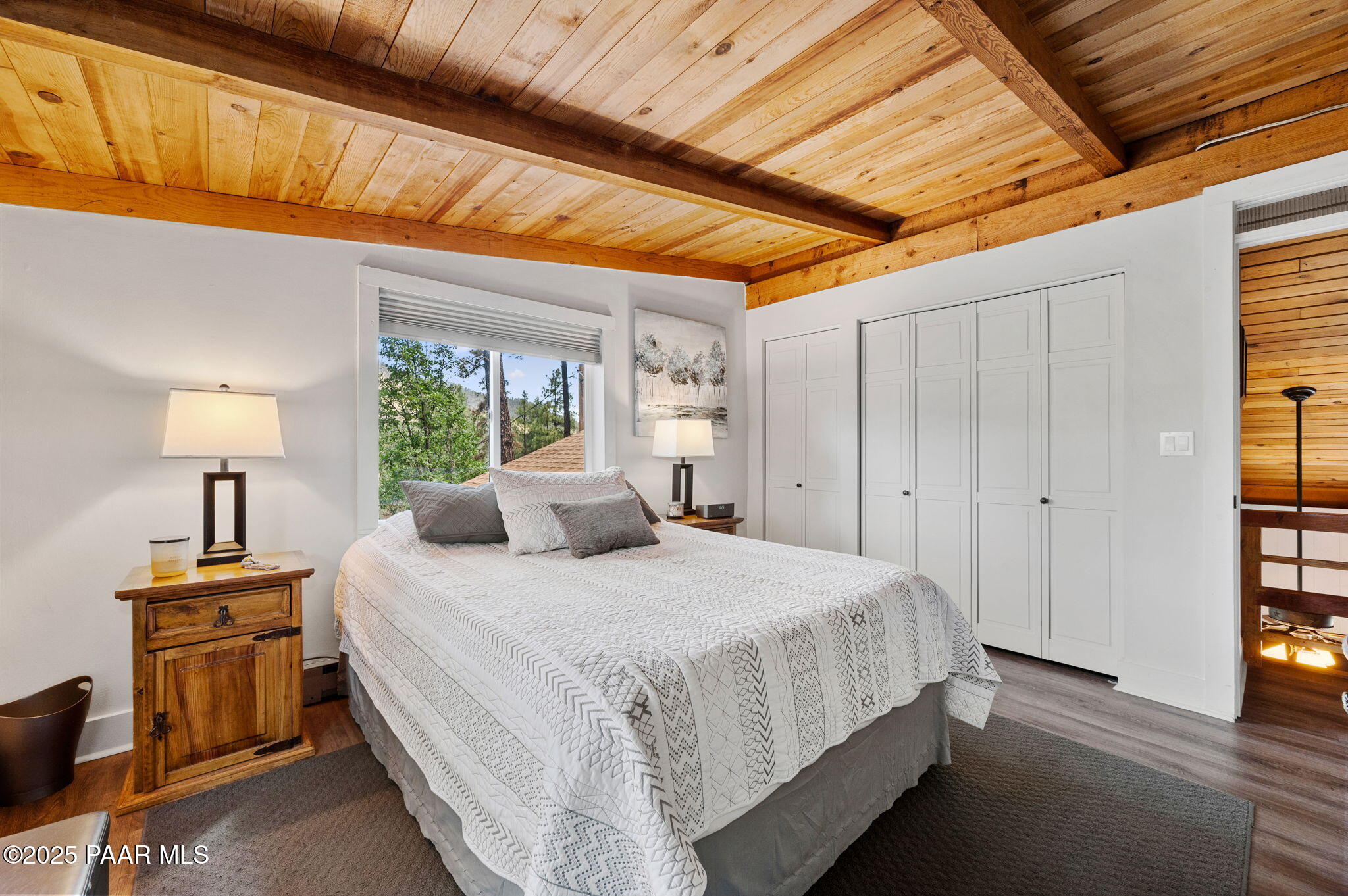 6231 South Champion Way Road Prescott, AZ 86303 - Photo 20 of 43 a bedroom with a bed and a lamp