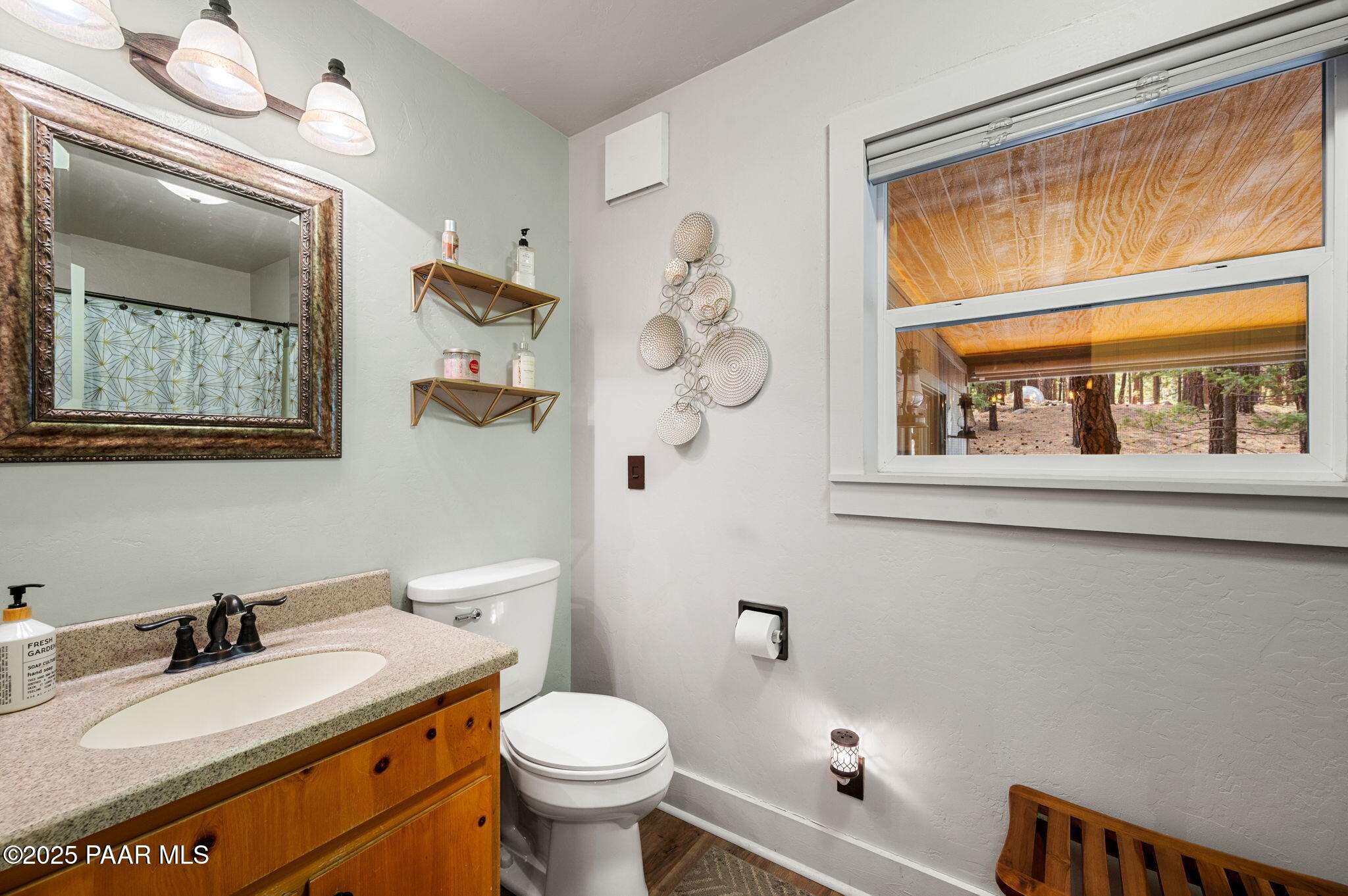 6231 South Champion Way Road Prescott, AZ 86303 - Photo 23 of 43 a bathroom with a granite countertop sink mirror vanity and toilet