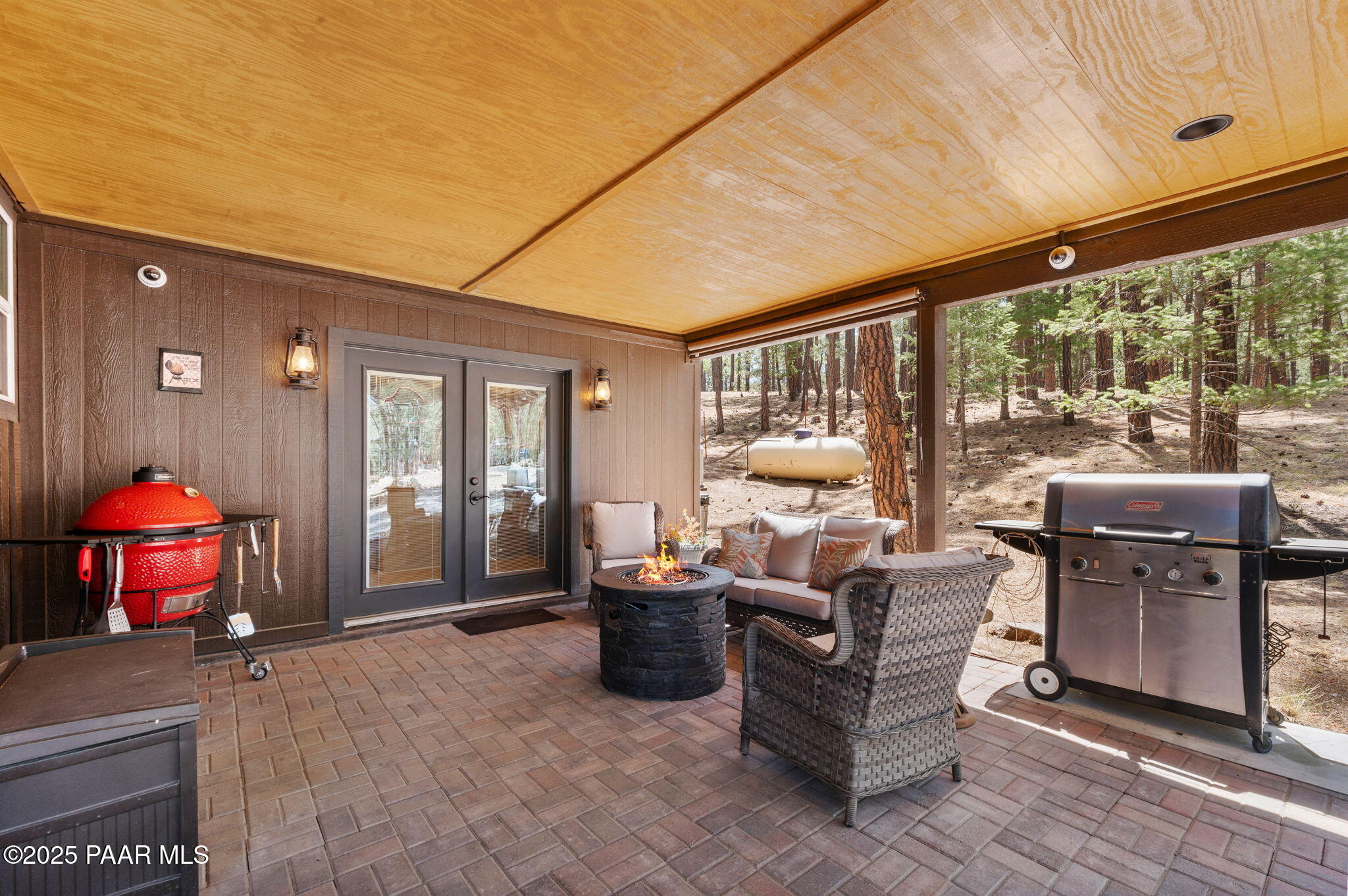 6231 South Champion Way Road Prescott, AZ 86303 - Photo 27 of 43 a living room with furniture and a floor to ceiling window