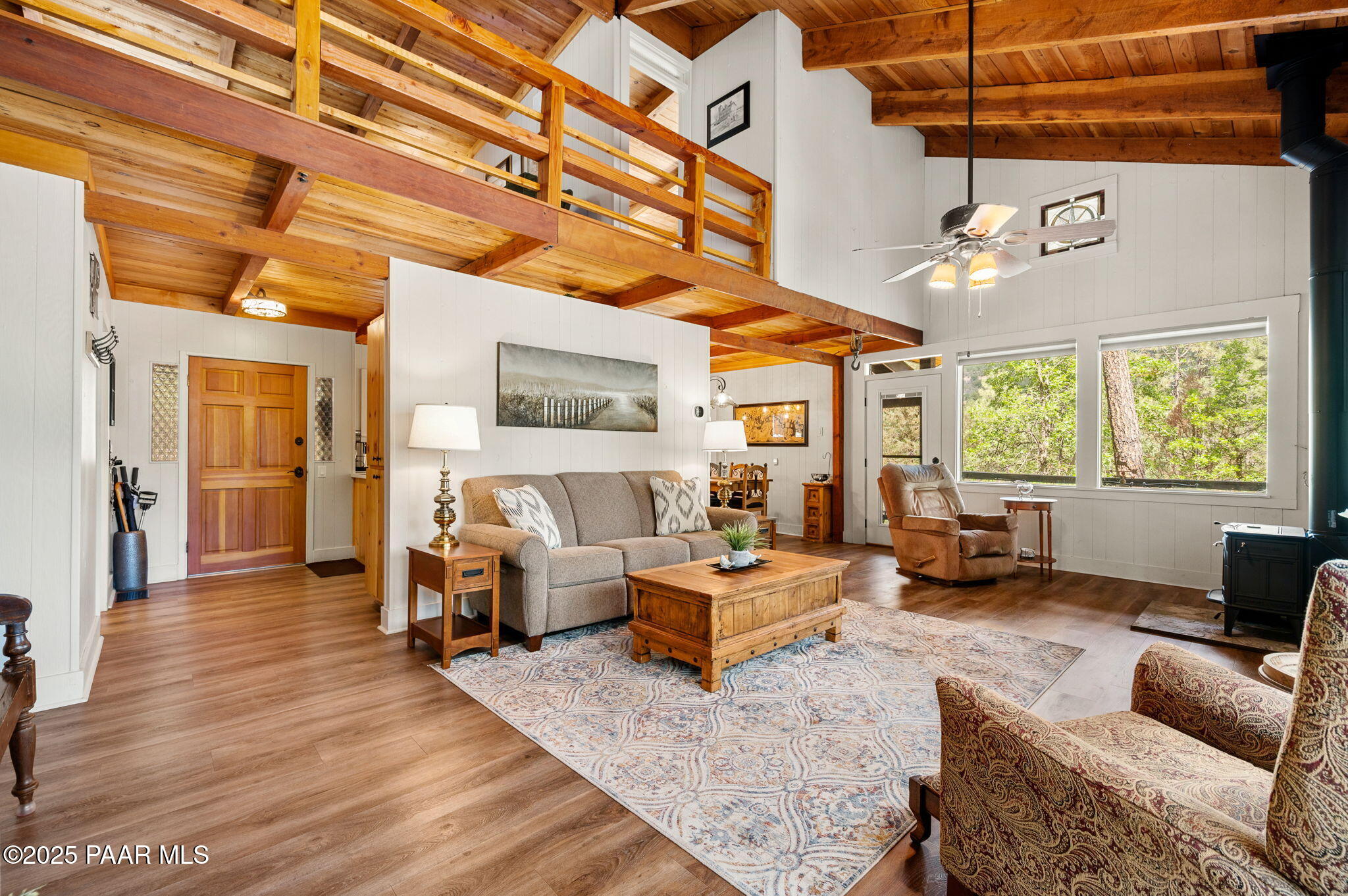 6231 South Champion Way Road Prescott, AZ 86303 - Photo 7 of 43 a living room with furniture and a large window