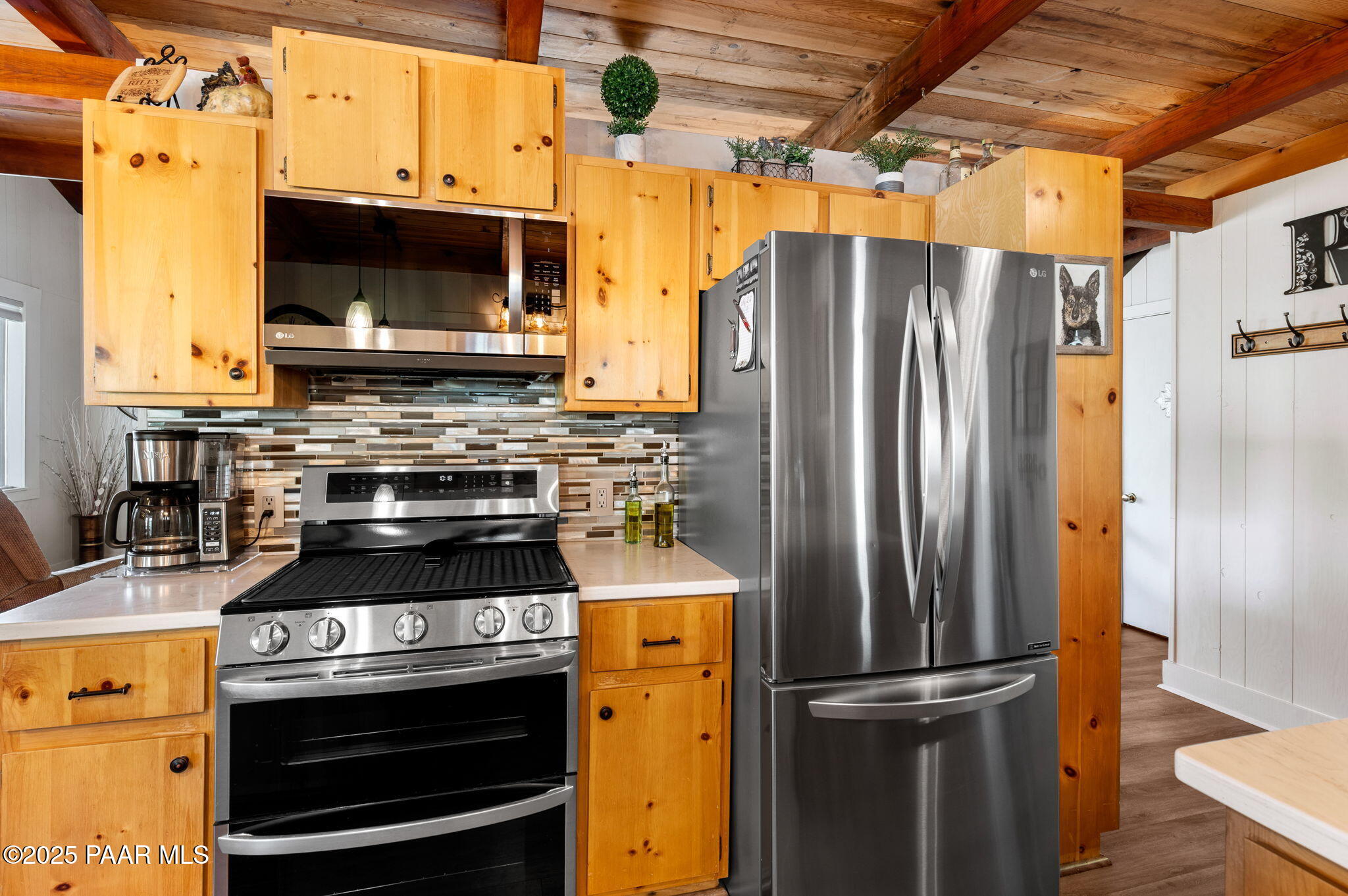 6231 South Champion Way Road Prescott, AZ 86303 - Photo 10 of 43 a kitchen with a stove and a refrigerator