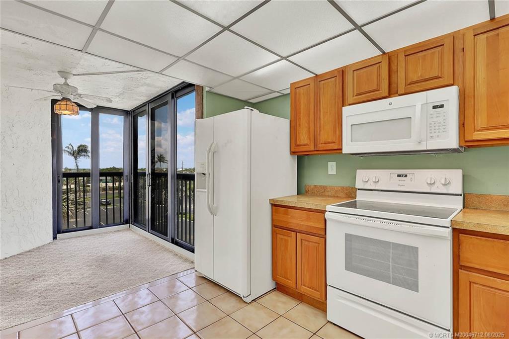 10600 South Ocean Drive, Unit 201 Jensen Beach, FL 34957 - Photo 13 of 40 a utility room with dryer and washer