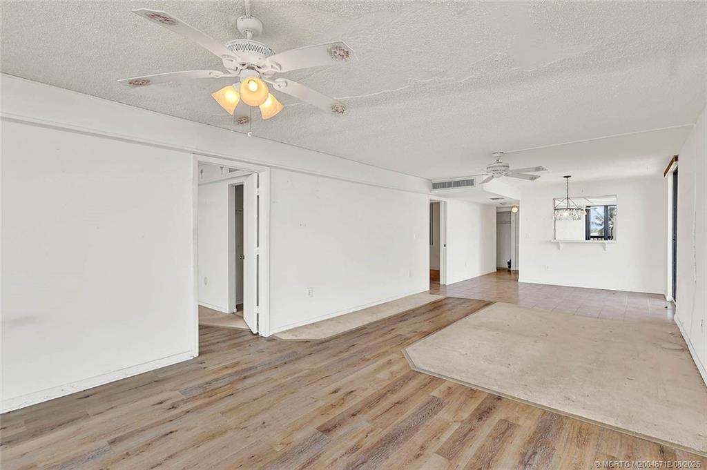 10600 South Ocean Drive, Unit 201 Jensen Beach, FL 34957 - Photo 19 of 40 a view of an empty room with wooden floor
