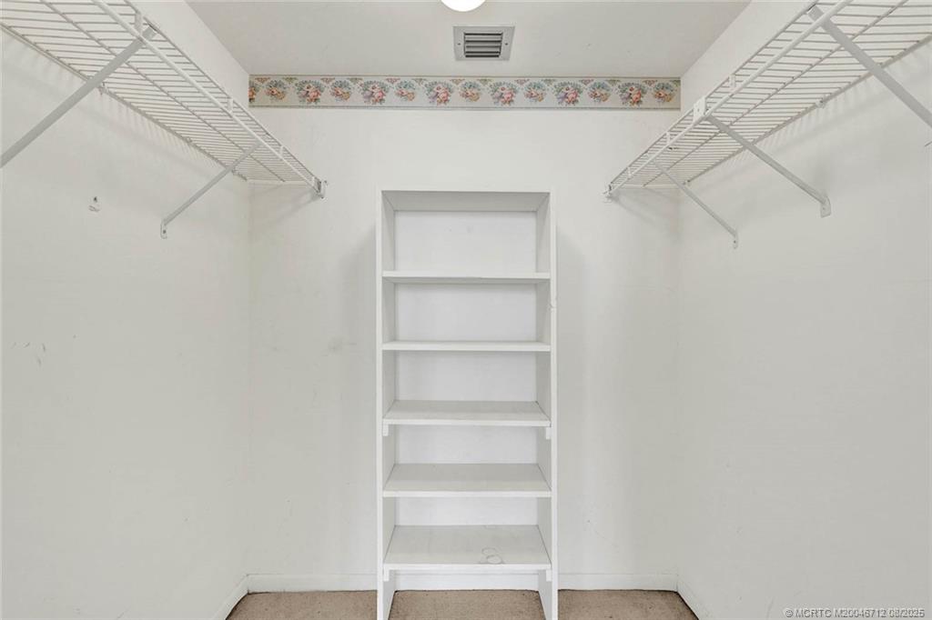 10600 South Ocean Drive, Unit 201 Jensen Beach, FL 34957 - Photo 27 of 40 a view of a room with racks on the wall