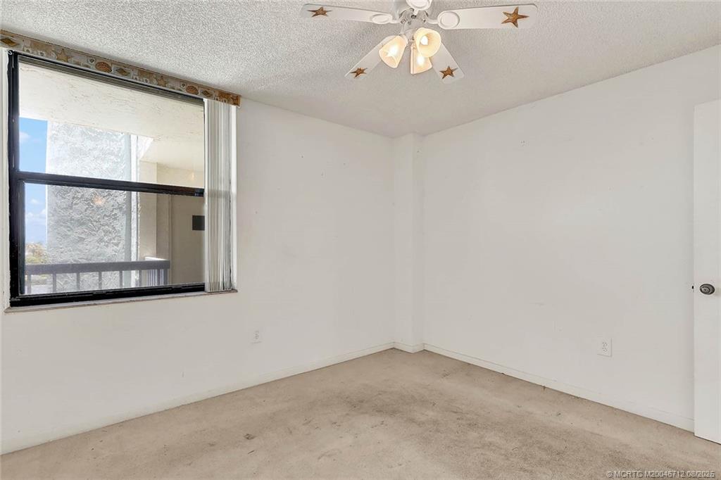 10600 South Ocean Drive, Unit 201 Jensen Beach, FL 34957 - Photo 30 of 40 an empty room with windows