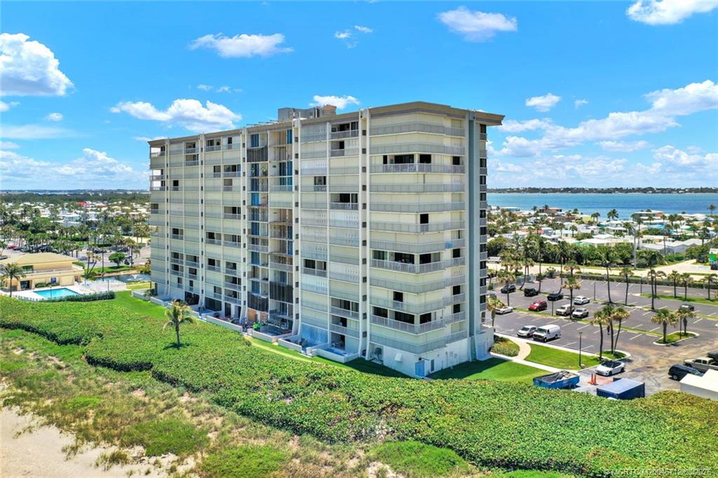 10600 South Ocean Drive, Unit 201 Jensen Beach, FL 34957 - Photo 34 of 40 a view of a building with a yard