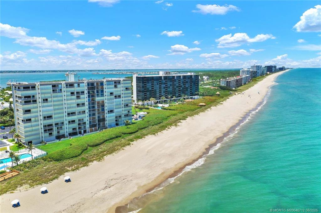 10600 South Ocean Drive, Unit 201 Jensen Beach, FL 34957 - Photo 36 of 40 a view of a garden with a building in the background