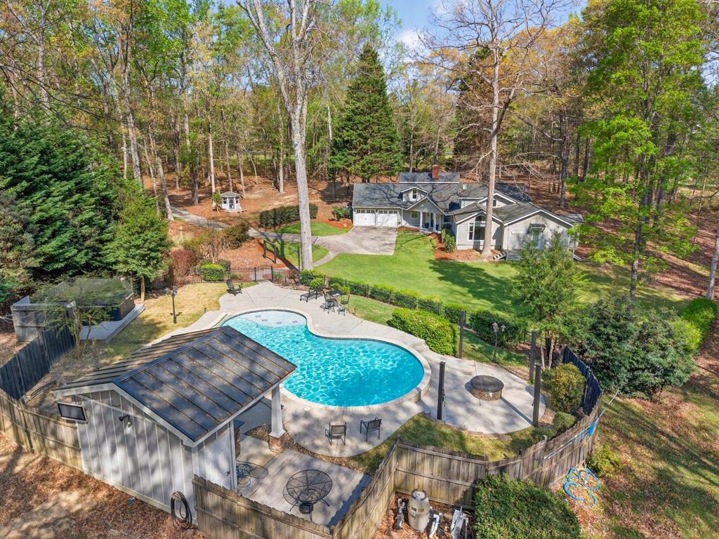 a view of a swimming pool with a patio