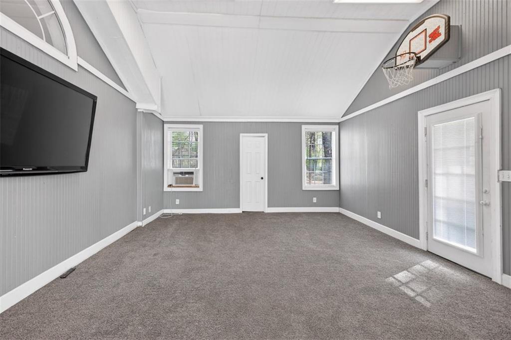627 Rock Springs Road Lawrenceville, GA 30043 - Photo 18 of 85 a view of an empty room with a flat screen tv