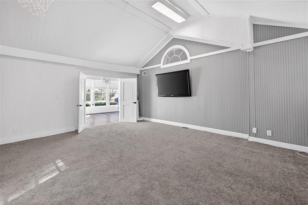 627 Rock Springs Road Lawrenceville, GA 30043 - Photo 20 of 85 a view of a livingroom with furniture and a flat screen tv