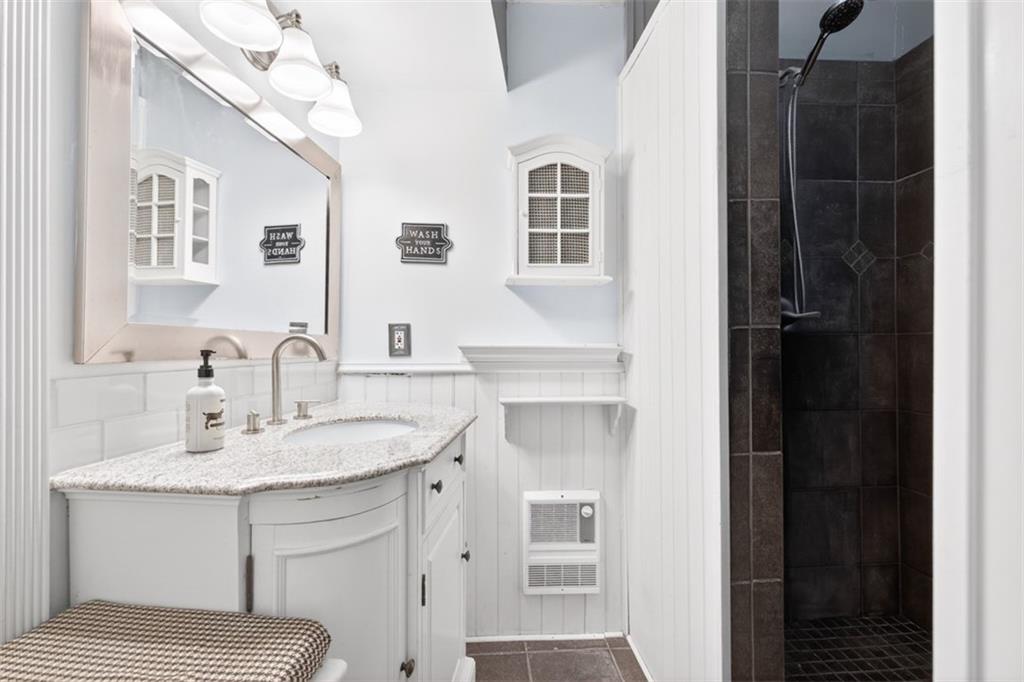 627 Rock Springs Road Lawrenceville, GA 30043 - Photo 25 of 85 a bathroom with a sink vanity granite and a mirror