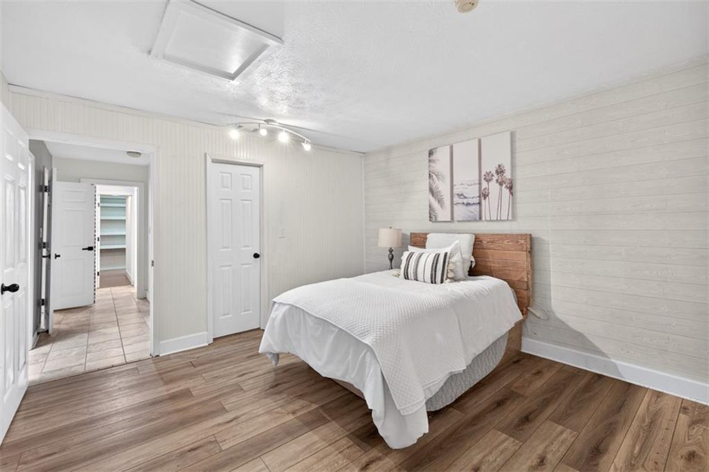 627 Rock Springs Road Lawrenceville, GA 30043 - Photo 31 of 85 a bedroom with a bed and wooden floor