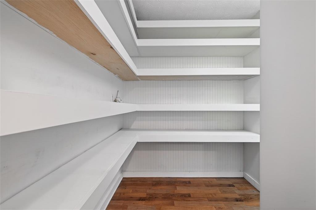 627 Rock Springs Road Lawrenceville, GA 30043 - Photo 40 of 85 a view of walk in closet with empty racks