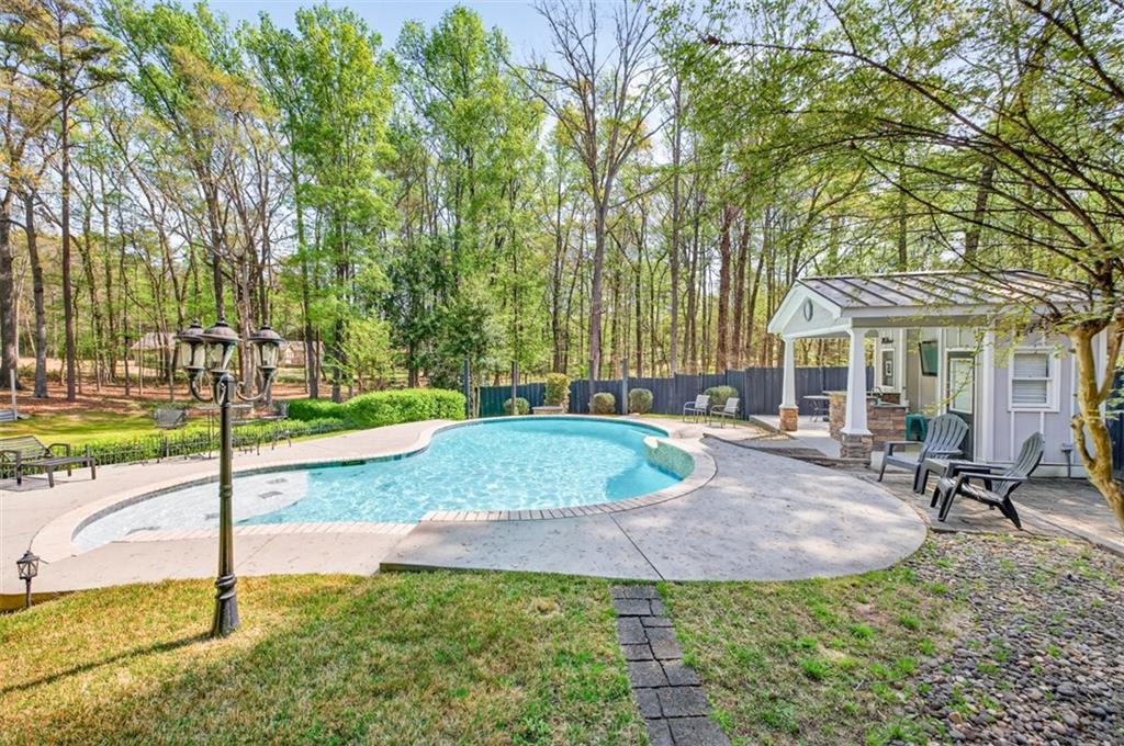 627 Rock Springs Road Lawrenceville, GA 30043 - Photo 54 of 85 a view of a house with backyard and sitting area