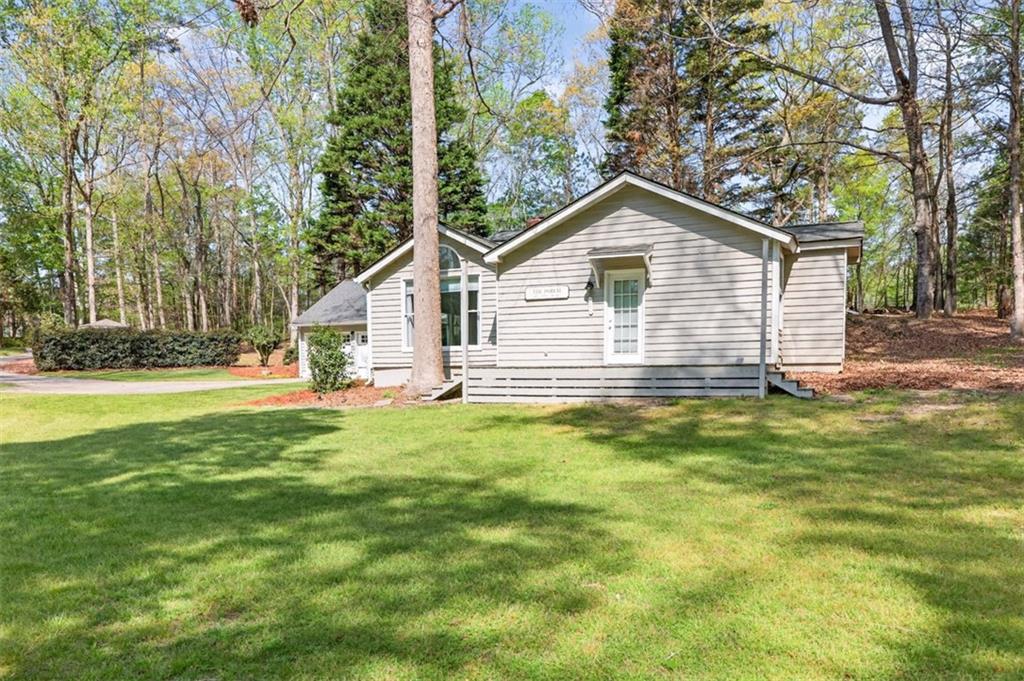 627 Rock Springs Road Lawrenceville, GA 30043 - Photo 67 of 85 a view of a house with a backyard