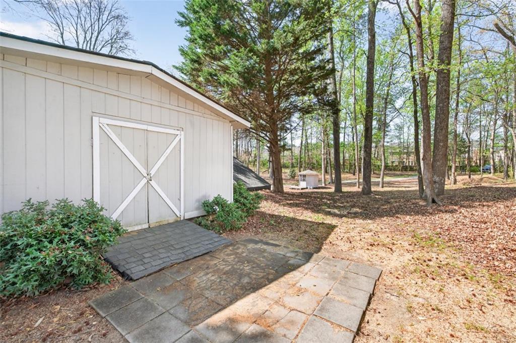 627 Rock Springs Road Lawrenceville, GA 30043 - Photo 70 of 85 a backyard of a house with lots of green space