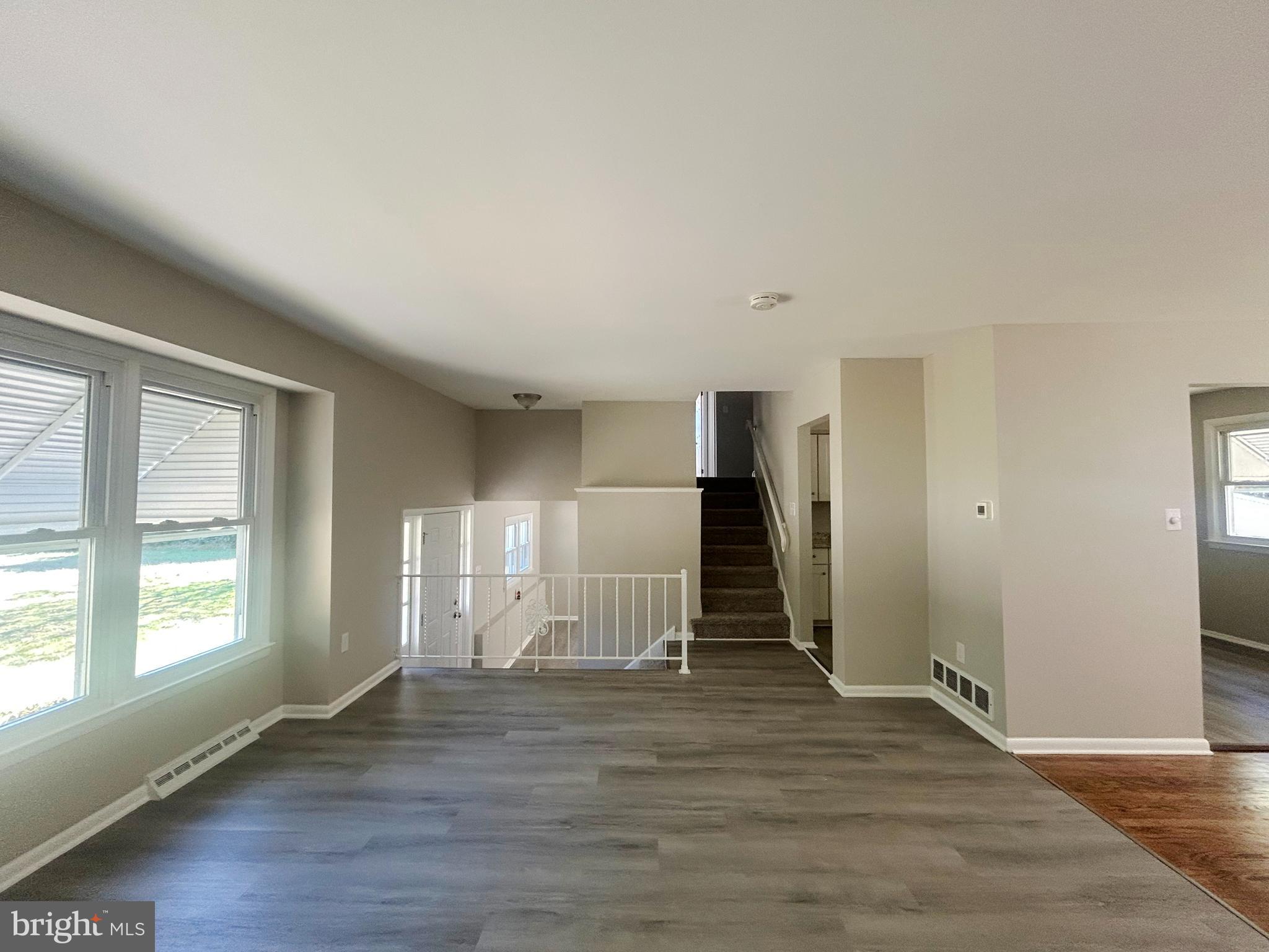 741 North Tuckahoe Road Williamstown, NJ 08094 - Photo 3 of 14 a view of empty room with wooden floor and window