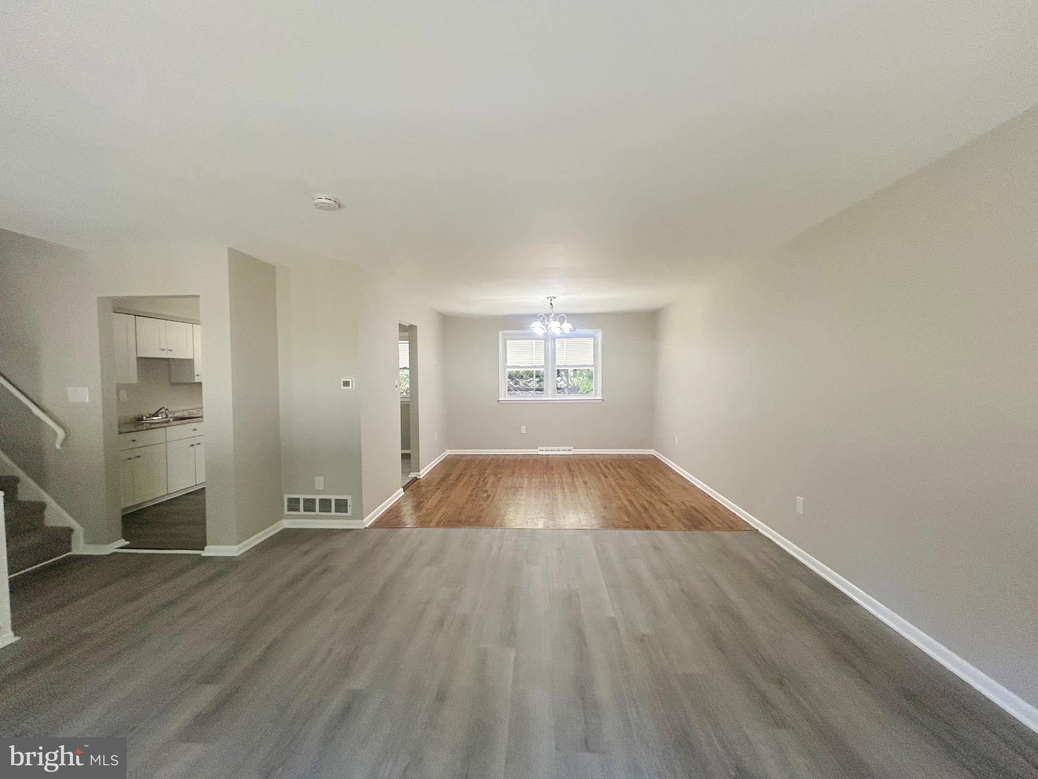 741 North Tuckahoe Road Williamstown, NJ 08094 - Photo 4 of 14 an empty room with wooden floor and windows