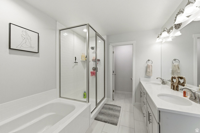 1038 South Old Towne Road Layton, UT 84041 - Photo 18 of 39 Bathroom featuring a tiled soaking tub and a clear glass shower enclosure with subway tile surround