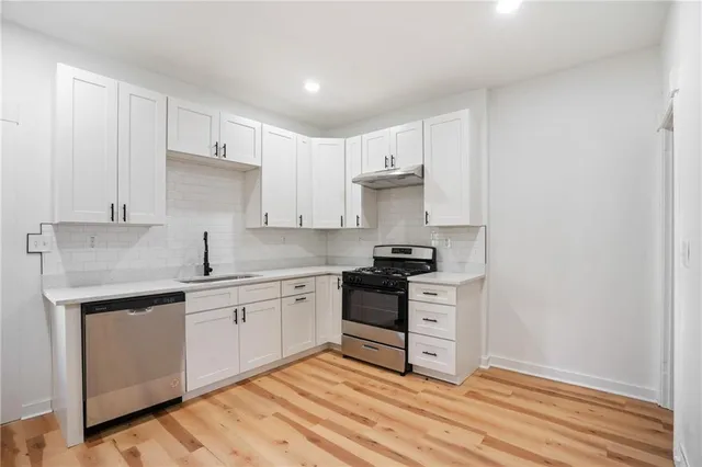 a view of an empty room and a window