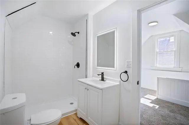 a view of backyard of house with green space