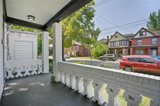 a view of hallway with wooden floor