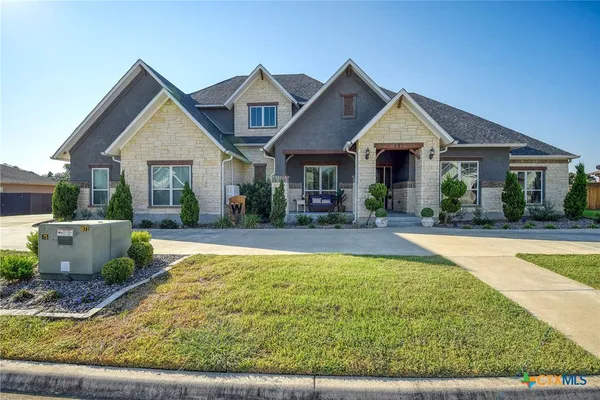 a view of house with swimming pool outdoor seating