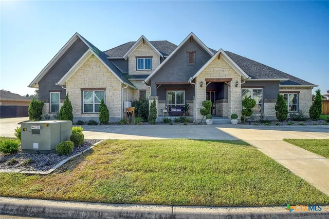 a view of house with swimming pool outdoor seating
