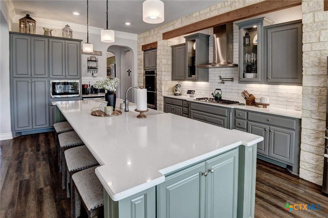 222 August Avenue Shiner, TX 77984 - Photo 14 of 48 a large white kitchen with a sink and dishwasher
