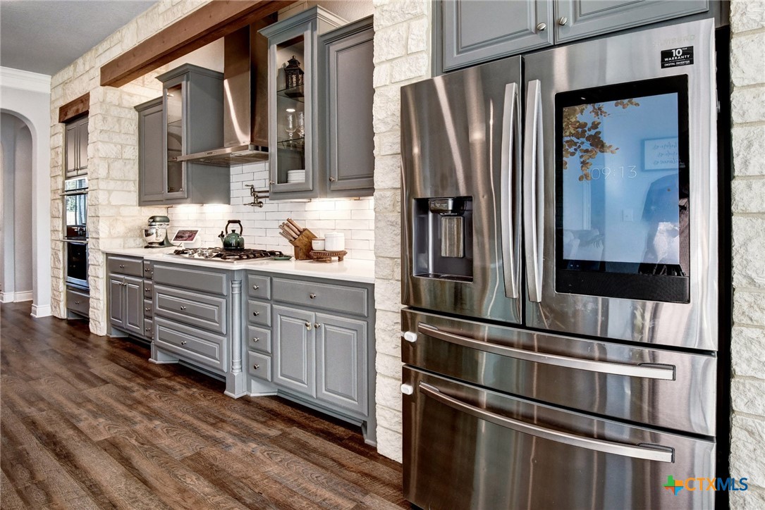 222 August Avenue Shiner, TX 77984 - Photo 15 of 48 a kitchen with stainless steel appliances a refrigerator and a sink
