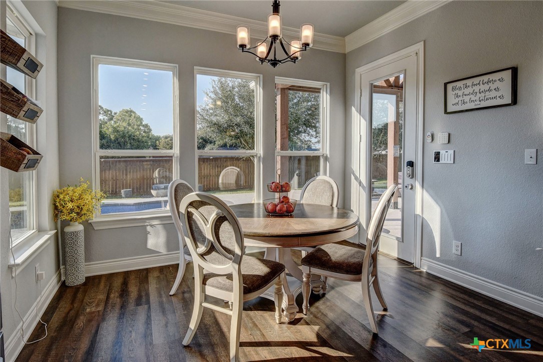 222 August Avenue Shiner, TX 77984 - Photo 18 of 48 a view of a dining room with furniture window and wooden floor
