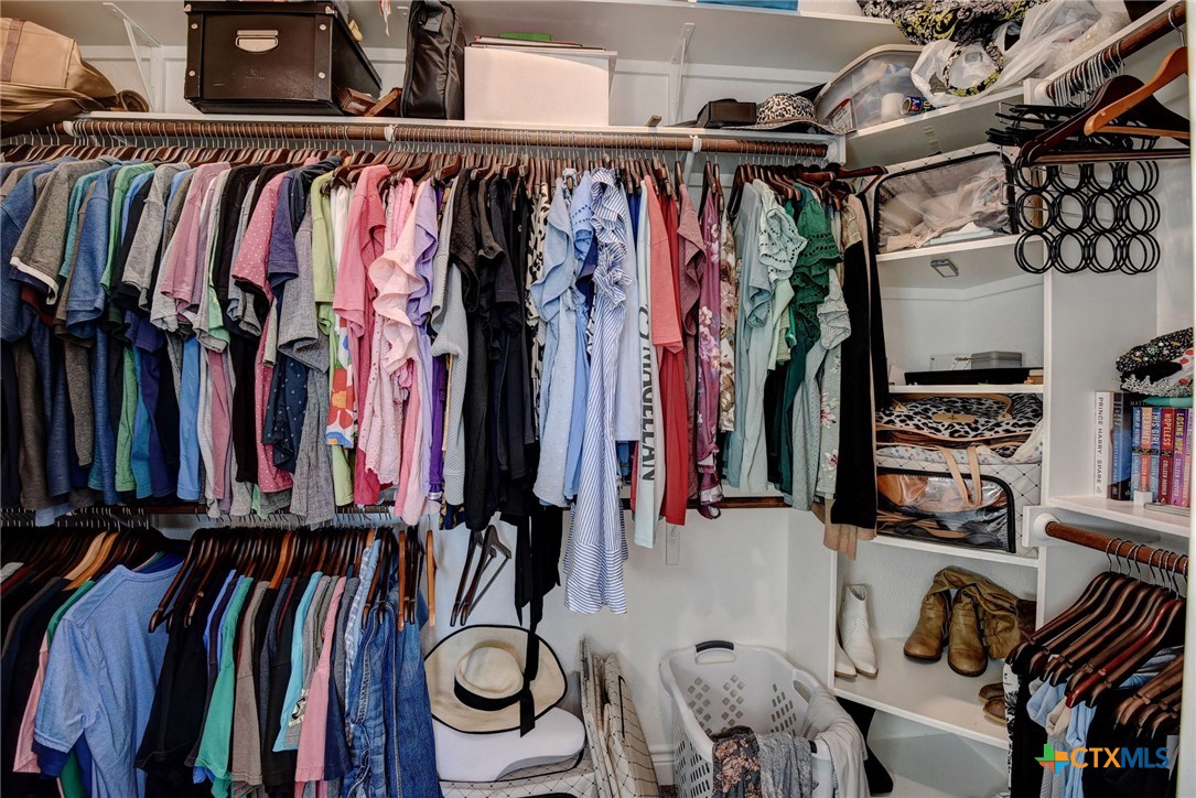 222 August Avenue Shiner, TX 77984 - Photo 26 of 48 a view of walk in closet with clothes and shoes