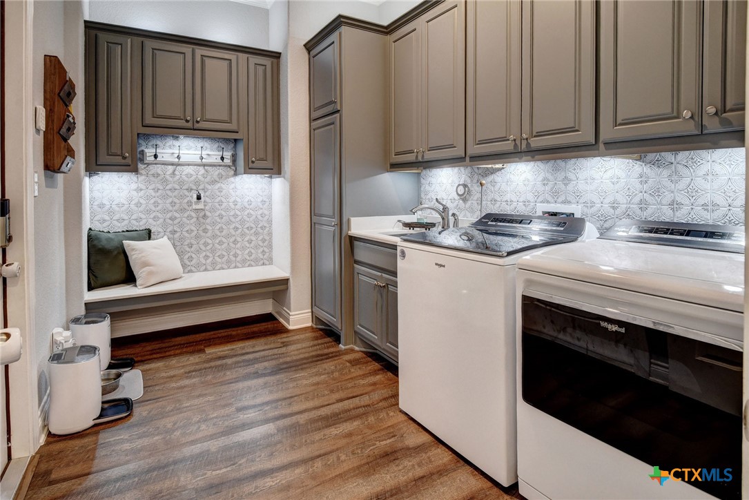 222 August Avenue Shiner, TX 77984 - Photo 28 of 48 a kitchen with a stove and a refrigerator