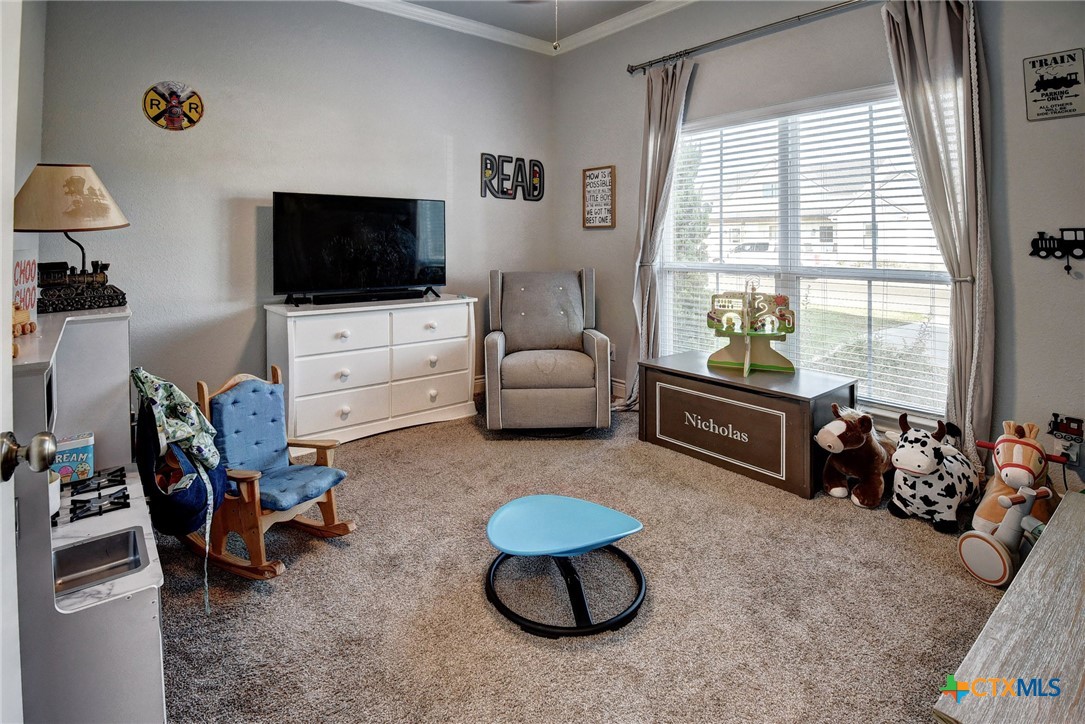 222 August Avenue Shiner, TX 77984 - Photo 31 of 48 a living room with furniture and a flat screen tv