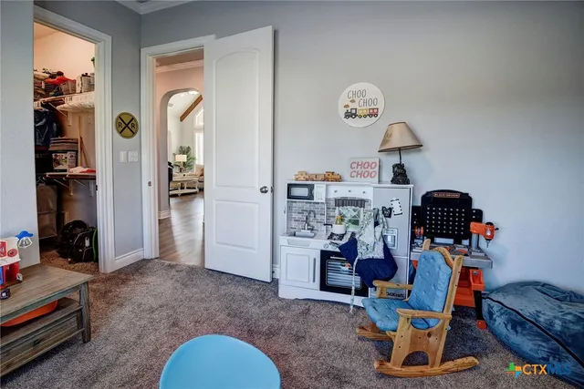 a bedroom with bed and window