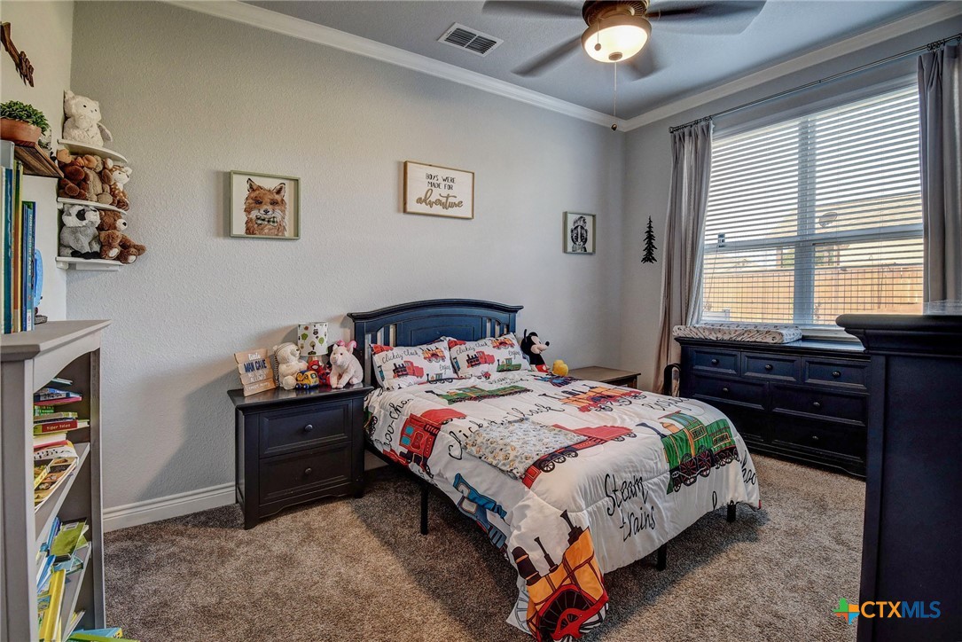 222 August Avenue Shiner, TX 77984 - Photo 34 of 48 a bedroom with bed and window