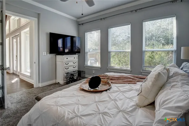 a bedroom with a bed and a dresser