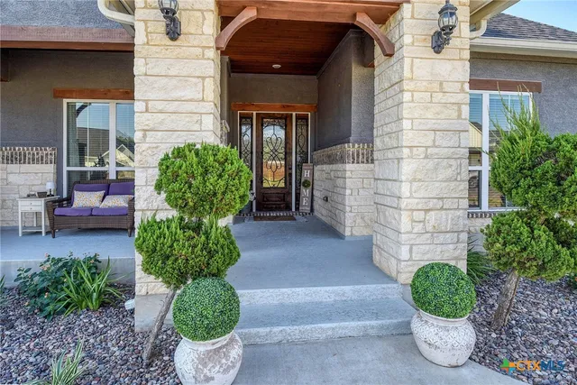 a front view of a house with garden