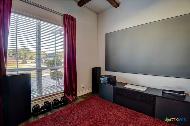 a view of a house with pool and chairs