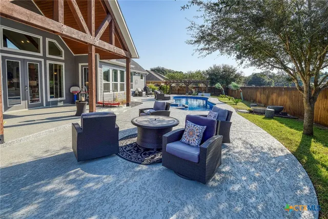 a view of yard with patio