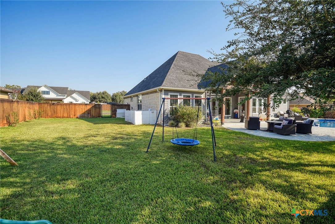 222 August Avenue Shiner, TX 77984 - Photo 48 of 48 a view of a house with a big yard and sitting area