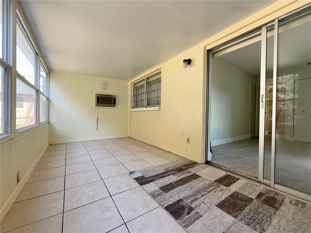 11817 Bayonet Lane New Port Richey, FL 34654 - Photo 13 of 32 an empty room with a rug