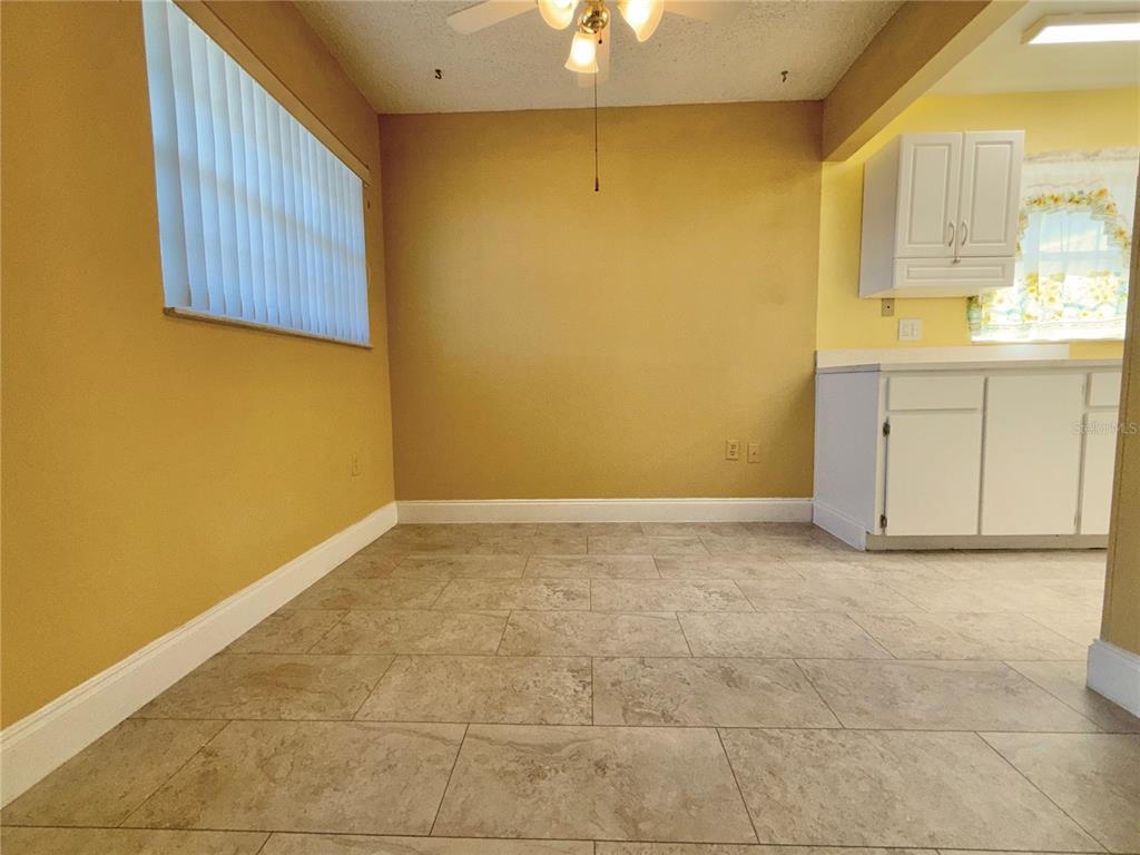 11817 Bayonet Lane New Port Richey, FL 34654 - Photo 4 of 32 a view of a kitchen with wooden floor